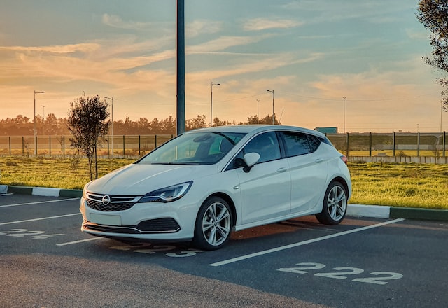 White Honda Sedan Car parked in a parking lot